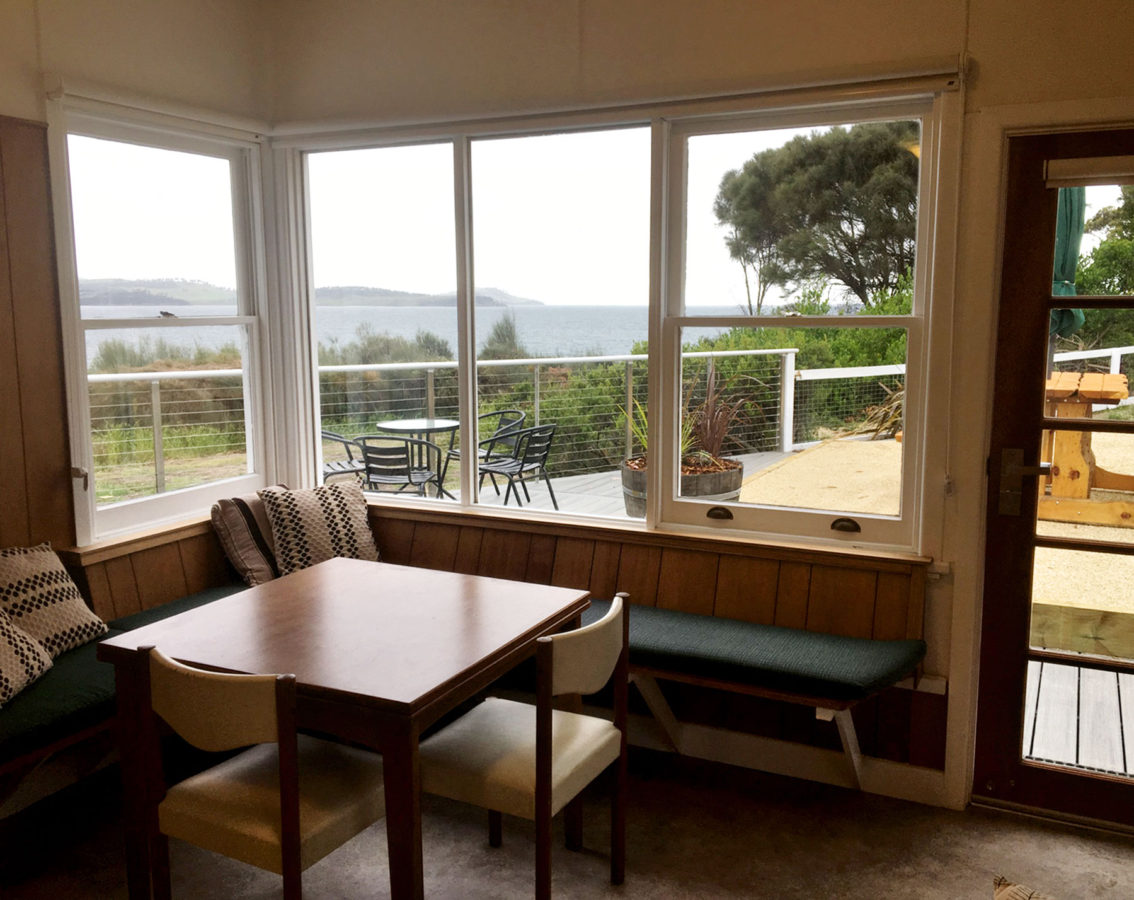 Breakfast dining area with sea view at Spring Beach Holiday House.
