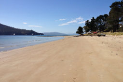 Nebraska Beach at Dennes Point on Bruny Island, with the jetty and sailing boats in the background.