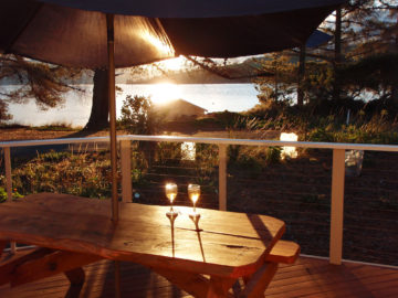 Enjoying a glass of wine and the sunset over D’Entrecasteaux Channel on Bruny Island.